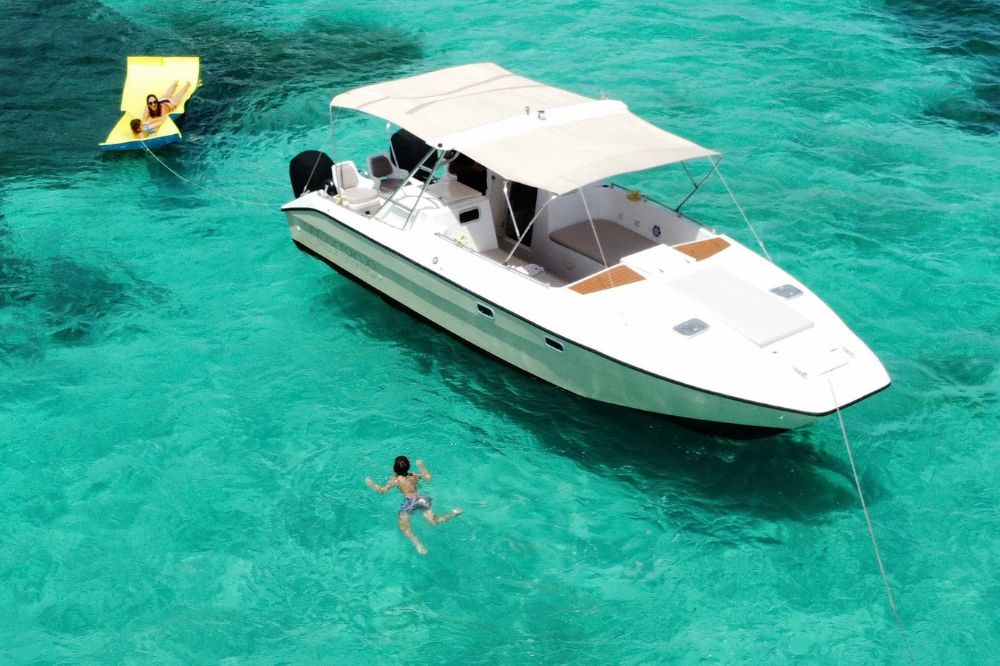 Come aboard the Pacific craft and settle in the aft on the L-shaped seating that features a center table.